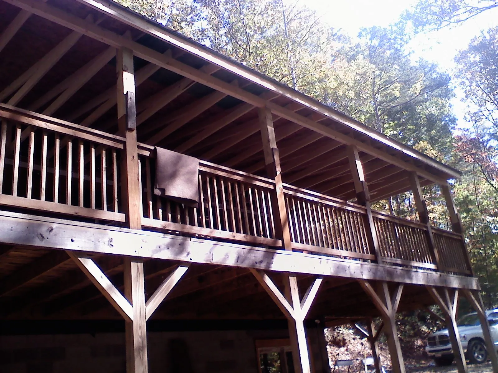 Timber framing under a new elevated porch and deck — Roof Leak Repair in Carrier by Roofing Brothers